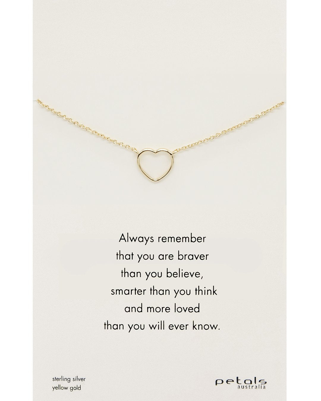 A necklace with a heart-shaped pendant on a card with the text 'Always remember that you are braver than you believe, smarter than you think, and more loved than you will ever know.' The necklace is made of gold plating.